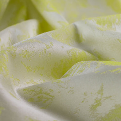 designer stretch floral jacquard fabric in lime green and white. Up close image