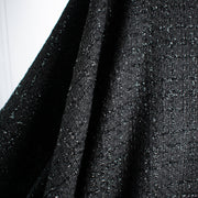 Can you envision the French Jacket?! Feel special in this drop dead gorgeous designer deadstock soft suiting. A black polyester fabric with shiny black detail in a geometric pattern. Photo of fabric drape.