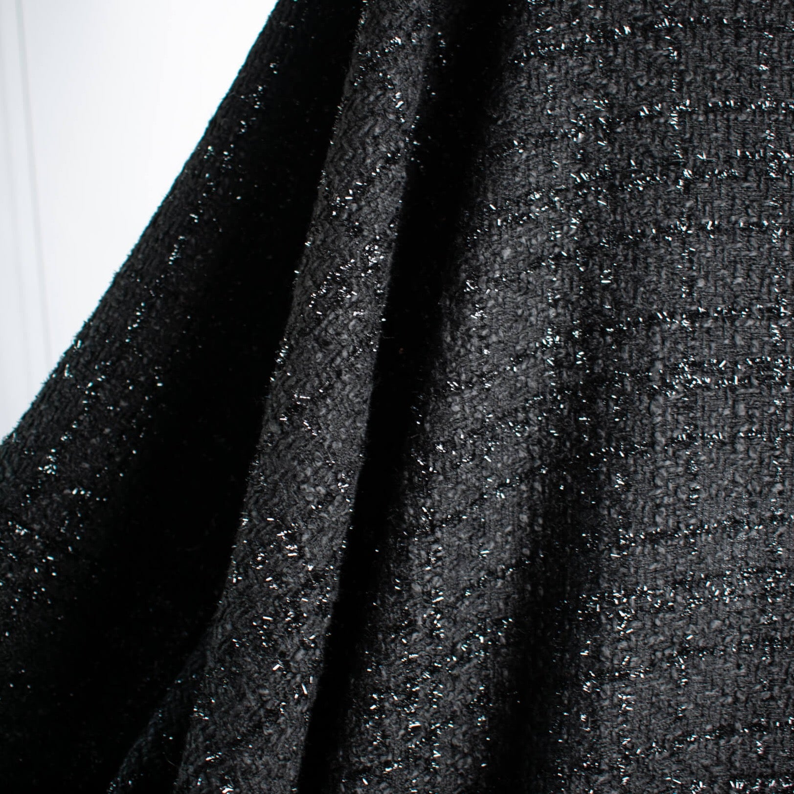 Can you envision the French Jacket?! Feel special in this drop dead gorgeous designer deadstock soft suiting. A black polyester fabric with shiny black detail in a geometric pattern. Photo of fabric drape.