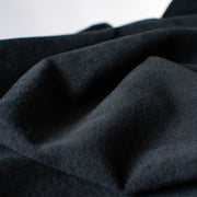 A luxurious faux suede that beckons fall style. Soft and smooth, this lovely medium weight designer fabric by a famous NYC designer will sew up a luscious skirt, dress or jacket. Close up photo.