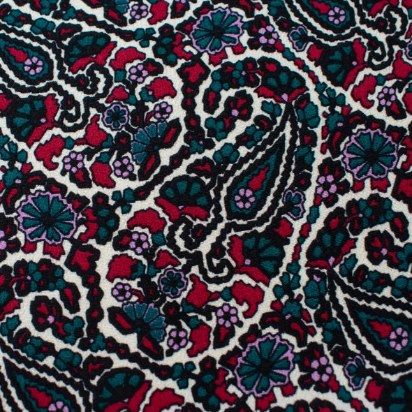 French Designer Is@bel M@rant - Paisley Italian Viscose Crepe - 'Isabel' Shop the same Italian mills the designers are with this stunning Italian viscose crepe. A sophisticated paisley in shades of green, red and a light 'peri', over an ivory background is just sublime. Close up image of paisley colors.