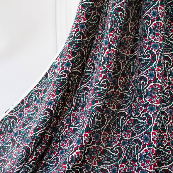 French Designer Is@bel M@rant - Paisley Italian Viscose Crepe - 'Isabel' Shop the same Italian mills the designers are with this stunning Italian viscose crepe. A sophisticated paisley in shades of green, red and a light 'peri', over an ivory background is just sublime. Image of fabric drape.