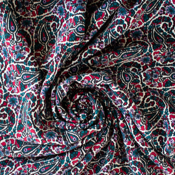 French Designer Is@bel M@rant - Paisley Italian Viscose Crepe - 'Isabel' Shop the same Italian mills the designers are with this stunning Italian viscose crepe. A sophisticated paisley in shades of green, red and a light 'peri', over an ivory background is just sublime. Image of fabric swirled.