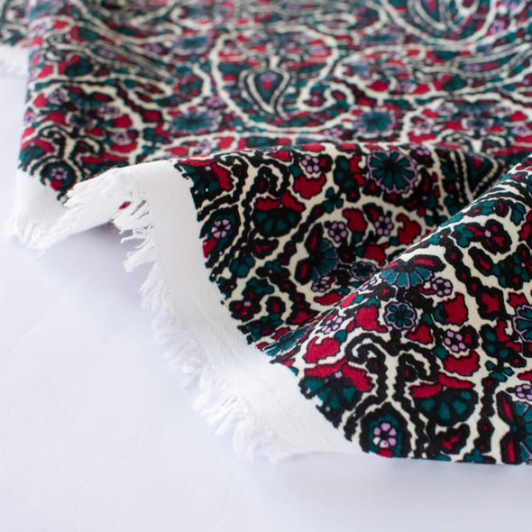 French Designer Is@bel M@rant - Paisley Italian Viscose Crepe - 'Isabel' Shop the same Italian mills the designers are with this stunning Italian viscose crepe. A sophisticated paisley in shades of green, red and a light 'peri', over an ivory background is just sublime. Image of selvedge.