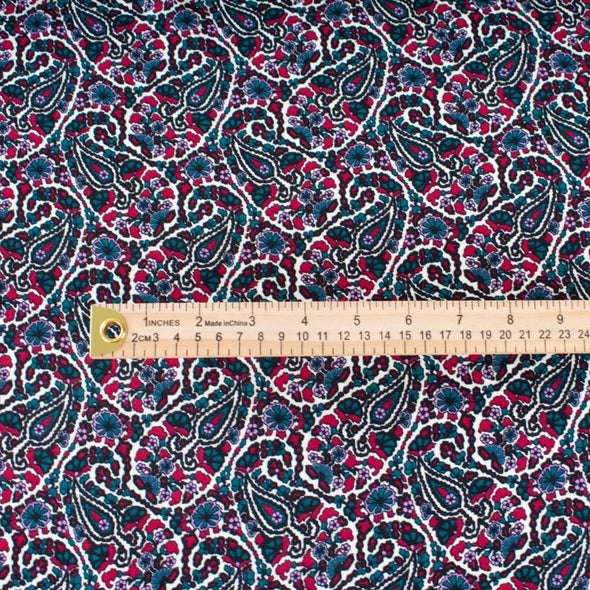 French Designer Is@bel M@rant - Paisley Italian Viscose Crepe - 'Isabel' Shop the same Italian mills the designers are with this stunning Italian viscose crepe. A sophisticated paisley in shades of green, red and a light 'peri', over an ivory background is just sublime. Image of fabric scale with ruler.