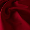 High-end designer Ponte knit in a gorgeous dark red. Create a stylish pencil skirt or make a bold statement in a red dress, either way you'll look fabulous! You'll love the soft touch of the fabric and the comfort of it's stretch. Close up image of fabric.