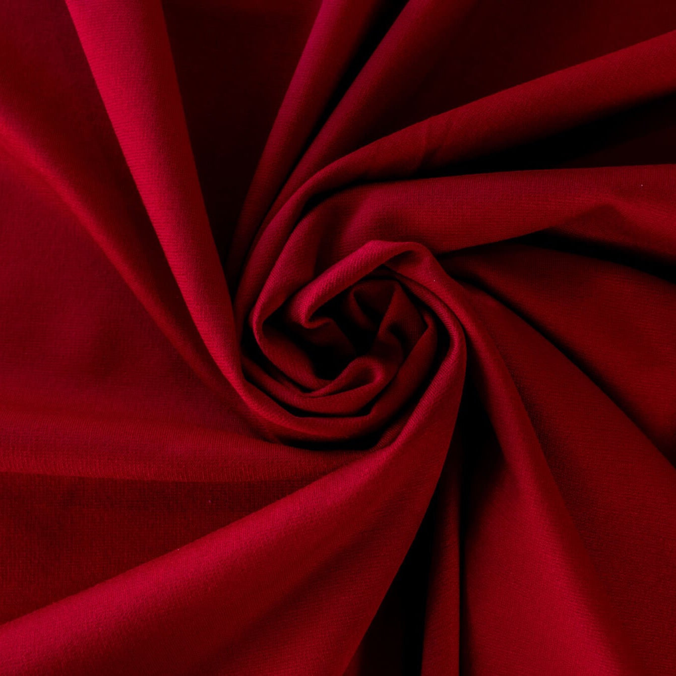 High-end designer Ponte knit in a gorgeous dark red. Create a stylish pencil skirt or make a bold statement in a red dress, either way you'll look fabulous! You'll love the soft touch of the fabric and the comfort of it's stretch. Image displaying fabric body.