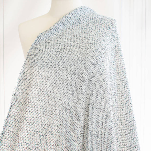 Cuddle up with a super soft textured boucle like sweater knit. Cream with flecks of gray and black are a perfect Spring and Summer choice for a cardigan or top.  Can't help but envision this with a bit of leather...tres chic!