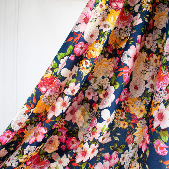 Share in the fun with this gorgeous tribute collection from the Italian mills. Exclusive Emanue1 Ung@ro floral prints are available in limited quantities.  The saturated blue in this fabric is just stunning!  Create a stunning dress of top with this gorgeous fabric. Image of fabric drape.