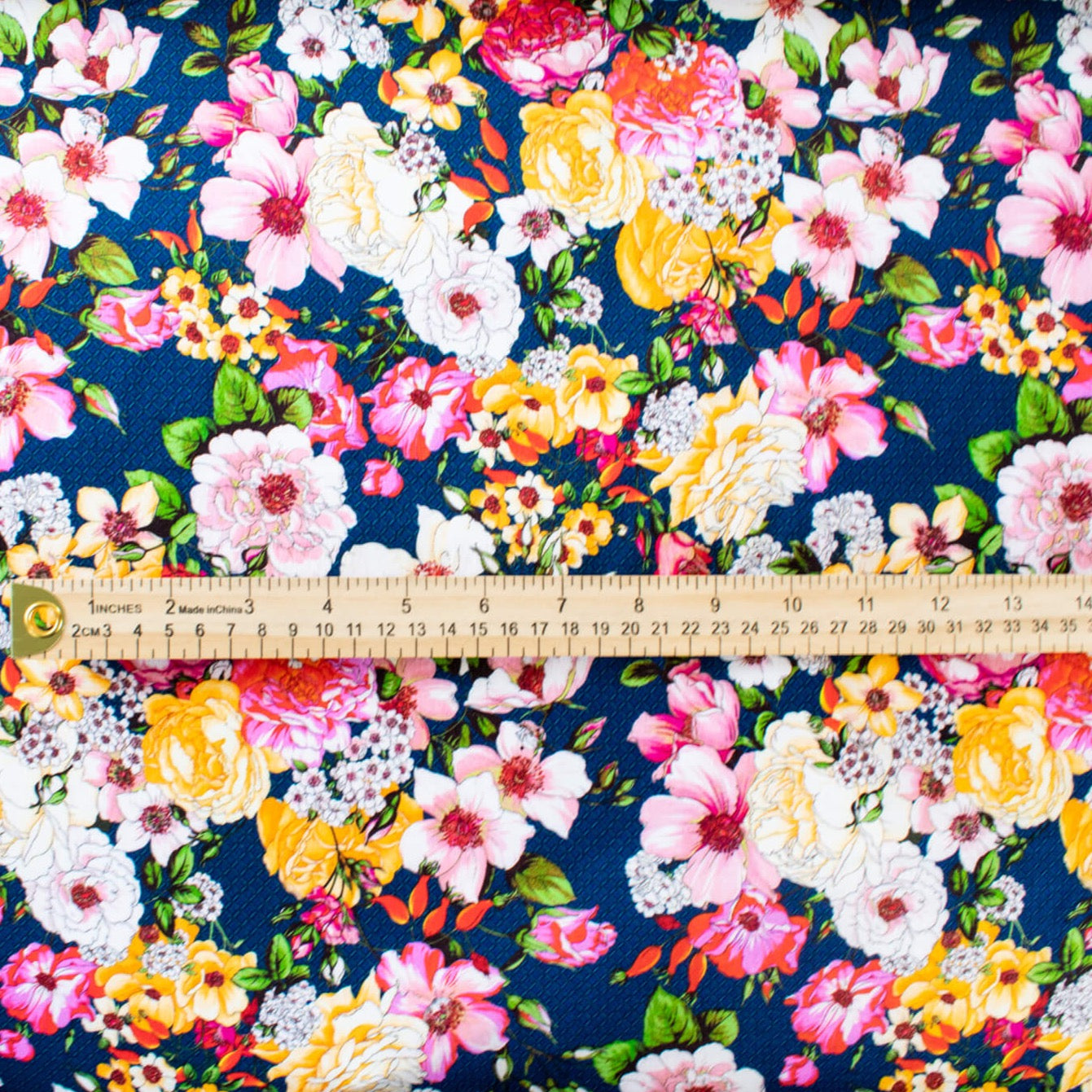 Share in the fun with this gorgeous tribute collection from the Italian mills. Exclusive Emanue1 Ung@ro floral prints are available in limited quantities.  The saturated blue in this fabric is just stunning!  Create a stunning dress of top with this gorgeous fabric. image with ruler for scale.