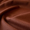 LA Designer silk noil in a gorgeous ginger color. A nice fabric for tailored and loose-fitting styles!  Perfect for a wide-leg  pant, or a tailored shirt dress or casual jacket.   Image closeup of fabric.