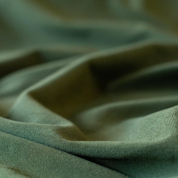 Designer ITY knit with a soft hand and fluid drape.  Perfect for wrap dresses or tops.  This knit has nice weight, it's light but it's not a slinky knit.  If you're just starting to work with ITY knits you will love how this sews up!  Close up image of fabric.