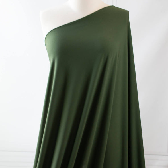Designer ITY knit with a soft hand and fluid drape.  Perfect for wrap dresses or tops.  This knit has nice weight, it's light but it's not a slinky knit.  If you're just starting to work with ITY knits you will love how this sews up!   Image of fabric draped on dressform.