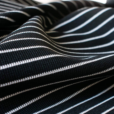 This soft semi-textured double knit imported from ITALY is such a versatile fabric choice. This classic stripe is stunning whether you are crafting a cardigan or whipping up a top or dress. Close up photo.