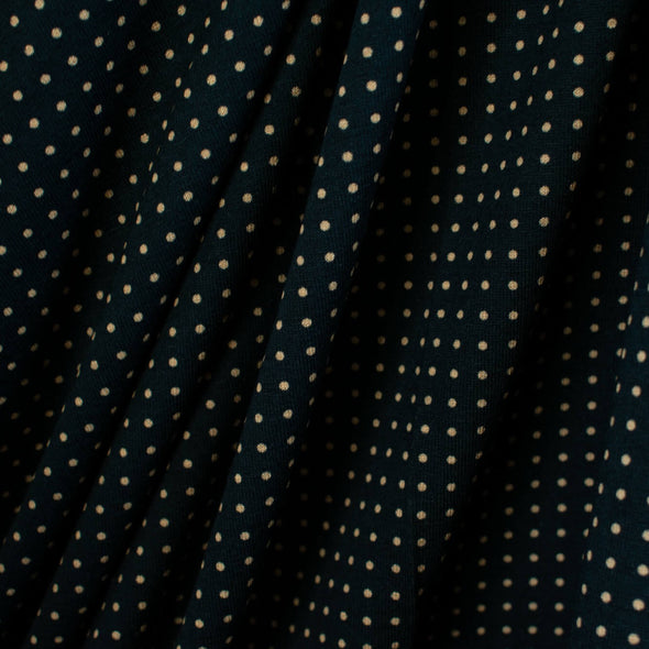 Imported from Italy, soft jersey knit in a classic polka dot fashion. Dark navy and tan, perfect for an iconic classic wrap dress! Photo of fabric drape.