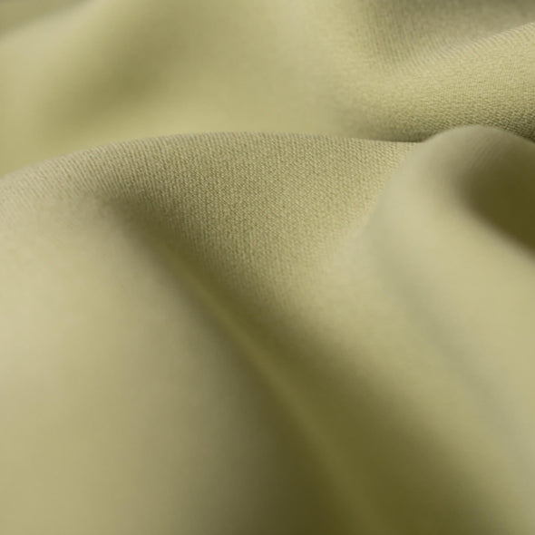 Stunning Italian silk blend suiting from a Los Angeles designer in pale green.  Close up image.