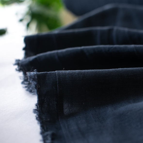 Richly saturated in color, this linen blend has a soft, textured hand and the familiar drape of rayon. Make up a gorgeous top, dress or skirt that stands out!  Translucent with a pleasing slubbed texture, may need lining for dresses and skirts.   Image of selvedge.
