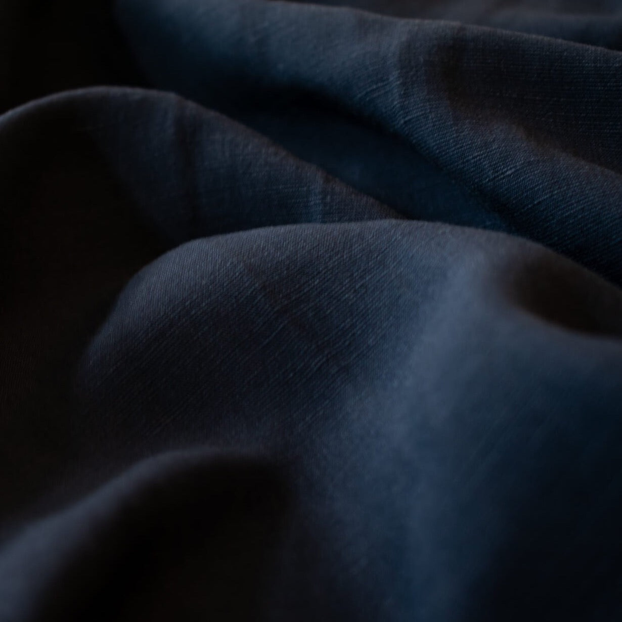 Richly saturated in color, this linen blend has a soft, textured hand and the familiar drape of rayon. Make up a gorgeous top, dress or skirt that stands out!  Translucent with a pleasing slubbed texture, may need lining for dresses and skirts.   Close up image.