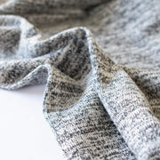 LA Designer Heathered Gray/Charcoal Lightweight Sweater Knit. Image of selvedge.