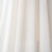 You will be dreaming of summer in this soft, sheer designer woven fabric.  This feels so good against the skin, a must have for summer dresses and tops. Gorgeous sewn up in a loose fitting garment or take advantage of the stripe and go for a bias cut!  Fabric has a white jacquard horizontal stripe against a white sheer background.   Image of fabric drape.