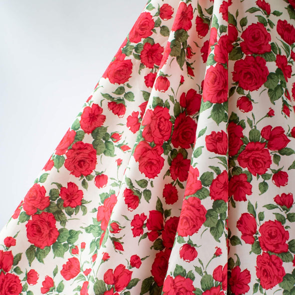 Create a stunning dress or a daring head to toe floral pant suit with this stunning Caroline Rose Tana Lawn fabric, a popular Liberty of London print. This particular print "...is an archival classic, originally painted in the 1990s to emulate the round beautiful forms of vintage 1950s florals." Photo of fabric drape. 