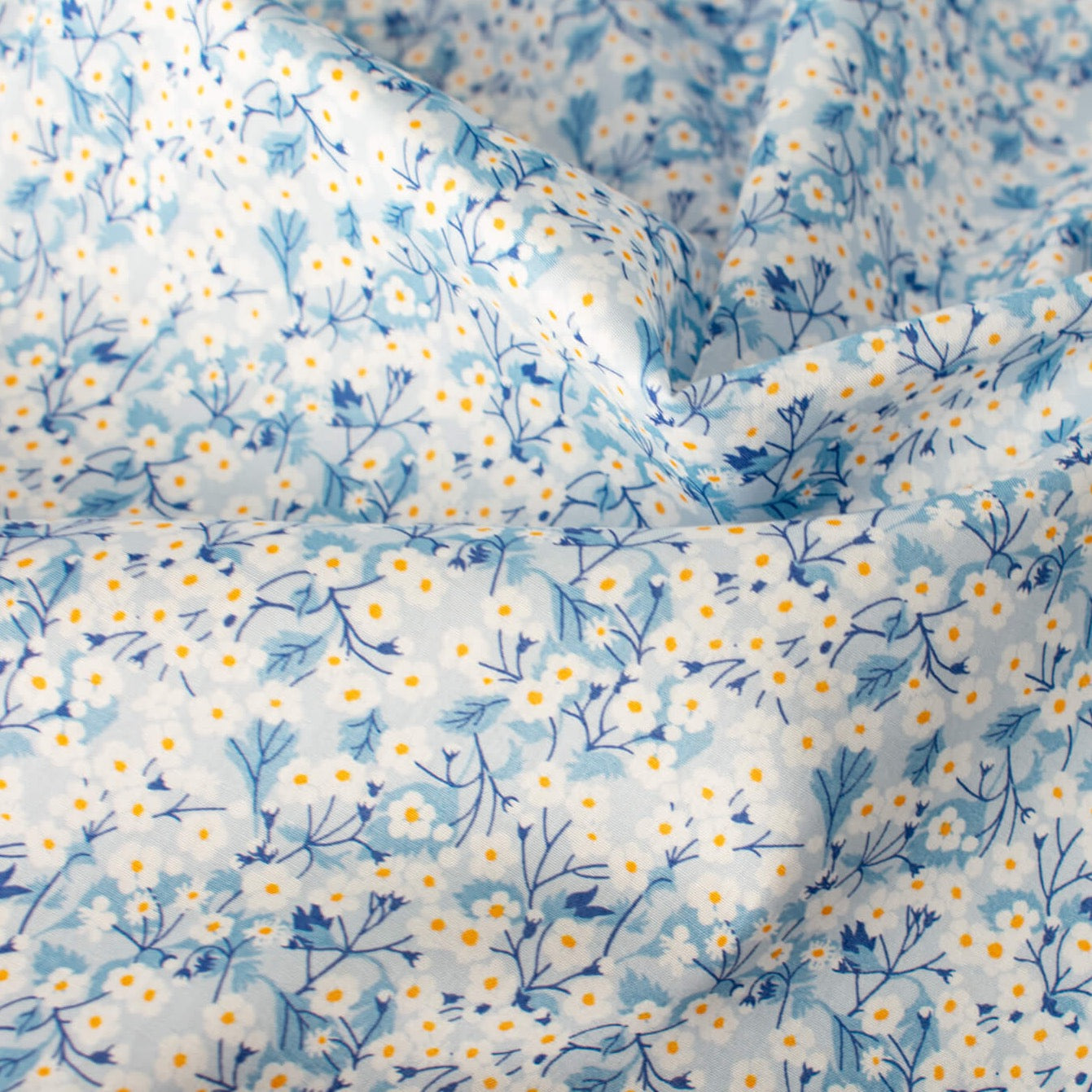 You are definitely in for a treat with this lovely Tana Lawn fabric from Liberty of London's trademark collection made in Italy. The Mitsi Valeria print is a small version of the Liberty Fabrics design popular Mitsi. Close up photo. 