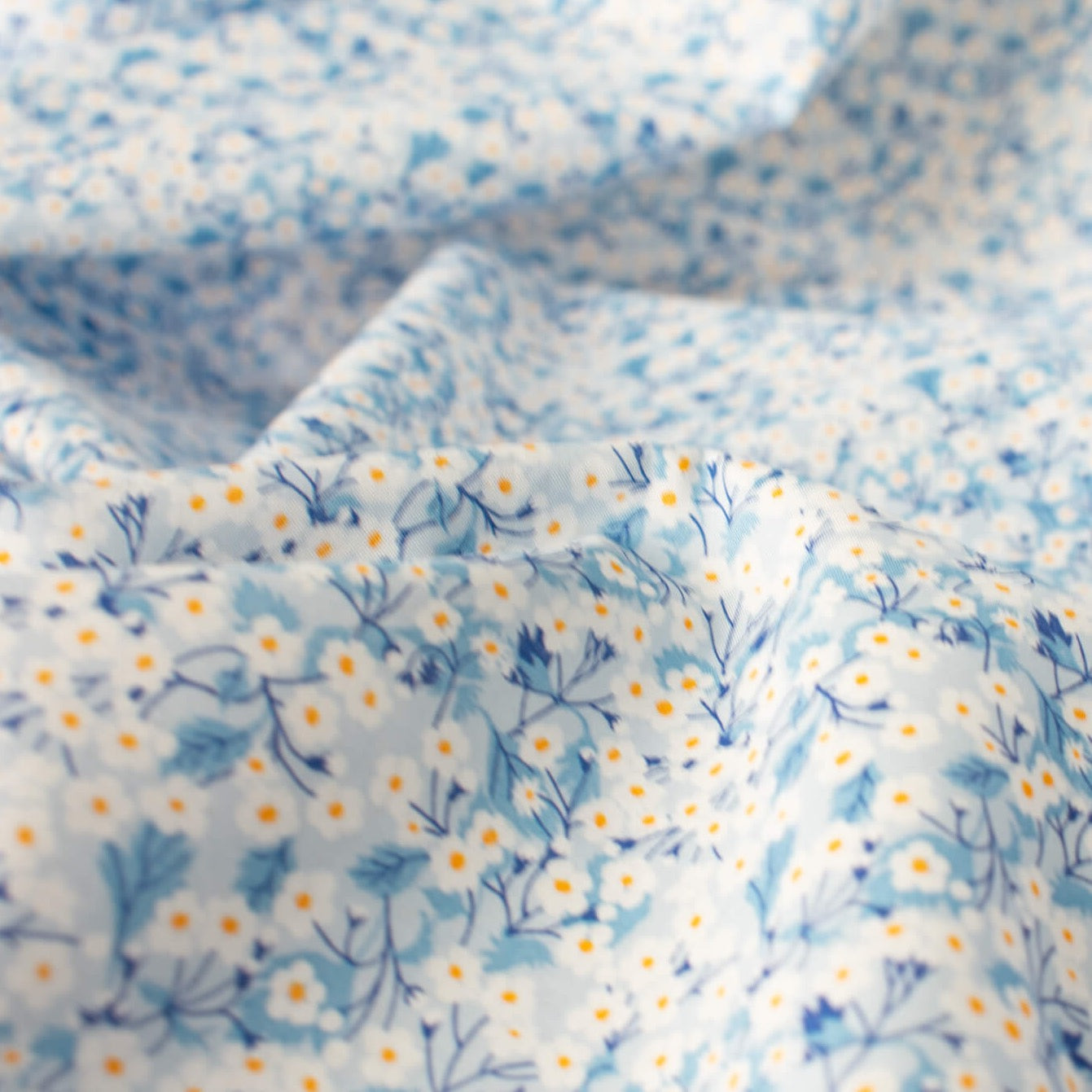 You are definitely in for a treat with this lovely Tana Lawn fabric from Liberty of London's trademark collection made in Italy. The Mitsi Valeria print is a small version of the Liberty Fabrics design popular Mitsi. Close up photo.