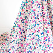 Liberty of London Atlas of Dreams Collection Rhapsody is an impressionistic floral design. You are definitely in for a treat with this lovely Tana Lawn fabric from Liberty of London's trademark collection made in Italy. Photo of fabric drape and print.