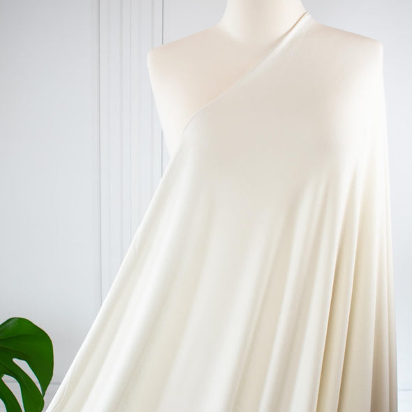 L.A. Designer Ivory jersey knit is so soft it just feels luxurious!  You will have so many options to sew up a favorite garment that just feels good to wear.  A lovely drape, a nice amount of stretch, just think of the possibilities!  Maxi dress anyone or, how about the chicest loungewear?