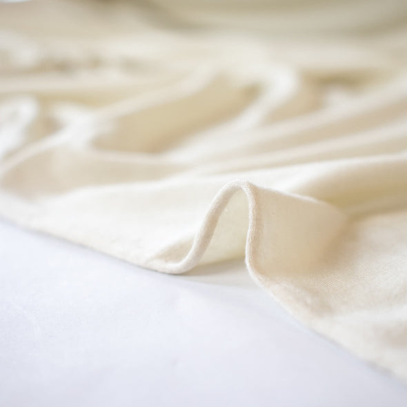 L.A. Designer Ivory jersey knit is so soft it just feels luxurious!  You will have so many options to sew up a favorite garment that just feels good to wear.  A lovely drape, a nice amount of stretch, just think of the possibilities!  Maxi dress anyone or, how about the chicest loungewear?