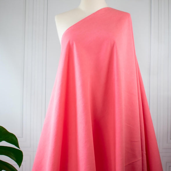 A gorgeous tencel/linen blend in a stunning pop of coral from designer M@ra Hoffm@n found in high end department stores like Bergdorf's and Neiman's.  This linen blend is soft with a semi-textured hand and is sure to become a favorite.   Image of fabric drape on dressform