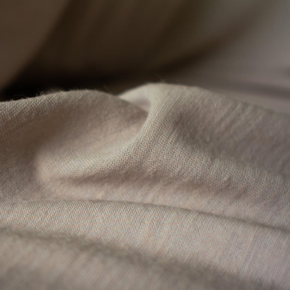 Merino Wool Jersey knit in a gorgeous truffle color.   This fabric has a soft hand and is light and flowy, perfect for a top or cardigan. It makes a perfect layering piece. A generous width at 55 inches and a mechanical stretch.  Close up image