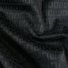 Create a stunning piece with this standout classic couture fabric with a modern geometric jacquard design. Closeup Photo.