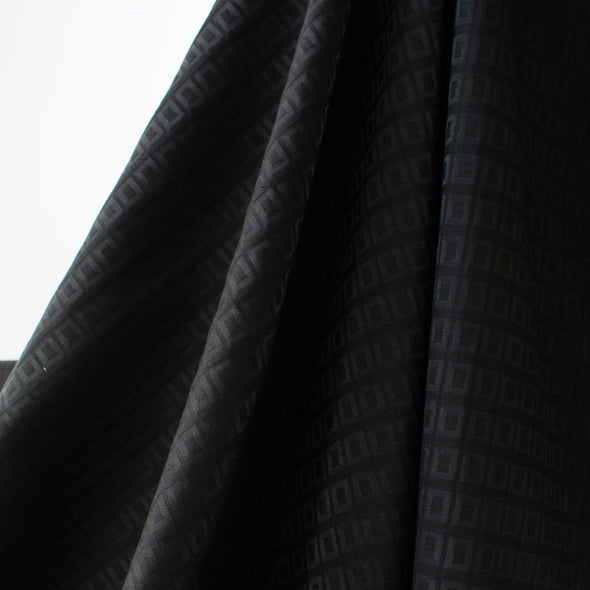 Create a stunning piece with this standout classic couture fabric with a modern geometric jacquard design. Photo of fabric drape.