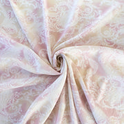 The soft pale rose and cream background with a white paisley print gives it a hint of 'Boho' vibe that's so L.A.    You'll look gorgeous in one of the popular flowy dresses or pants.  Or, if you prefer a sleeker look, this is a bias cut slip dress waiting to happen. Image of fabric body.