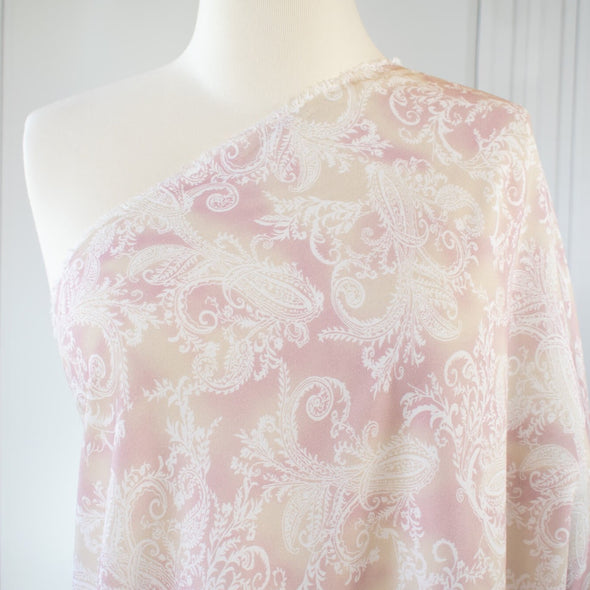 The soft pale rose and cream background with a white paisley print gives it a hint of 'Boho' vibe that's so L.A.    You'll look gorgeous in one of the popular flowy dresses or pants.  Or, if you prefer a sleeker look, this is a bias cut slip dress waiting to happen.  Fabric draped on dress form