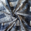 Modern, smooth and a dream to sew! This white and navy abstract plaid techno knit is not as thick as a scuba knit but does lay gently over our curves.  Choose this fabric as you would a double knit as it does have some fullness. Perfect for a pencil skirt, fitted sheath dress or a top.  image of fabric fullness.