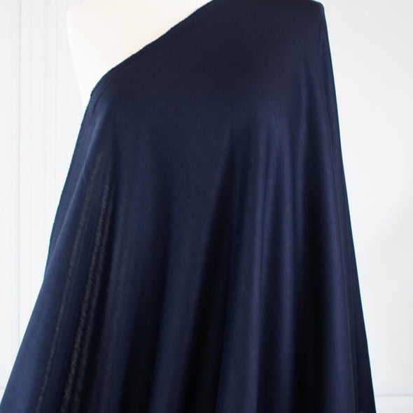 This designer navy Ponte has the simple elegance that minimalist fashion is known for and the comfort of cotton. Perfect if you’re working on a capsule wardrobe!  Image of fabric on dressform