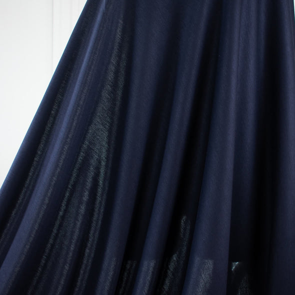 This designer navy Ponte has the simple elegance that minimalist fashion is known for and the comfort of cotton. Perfect if you’re working on a capsule wardrobe!  Image of fabric drape.
