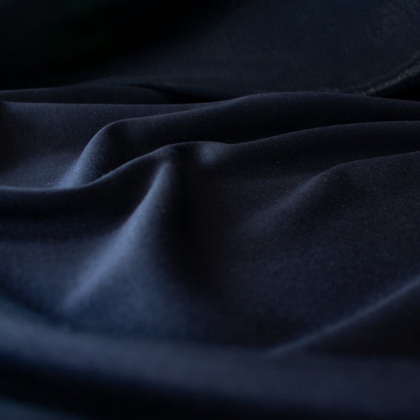 This designer navy Ponte has the simple elegance that minimalist fashion is known for and the comfort of cotton. Perfect if you’re working on a capsule wardrobe!  Close up image
