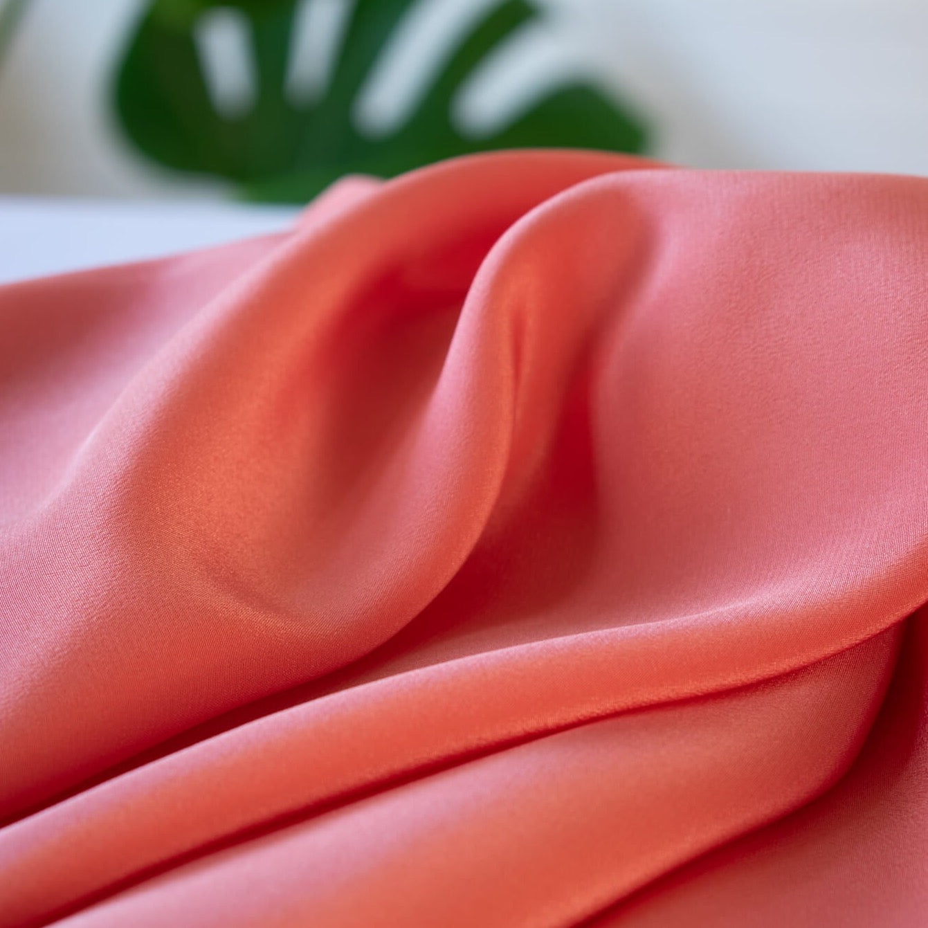 Universally flattering, salmon pink crepe de chine. The soft, semi-textured fluid drape will create a lovely dress or top for your next sewing adventure.