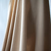 Washed linen blend has a soft, textured, slightly crisp hand, and some drape from the rayon. Make up a gorgeous top, dress or skirt that stands out!  Translucent with a washed look and pleasing slubbed texture, may need lining for dresses and skirts. Image of fabric drape.