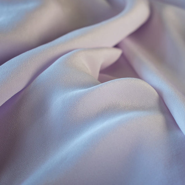 Dreamy Wisteria Purple 100% Silk Crepe de Chine ...brings to mind the first spring blooms. Create a lovely top or dress in this soft color that is versatile and flattering. Photo of fabric flow.