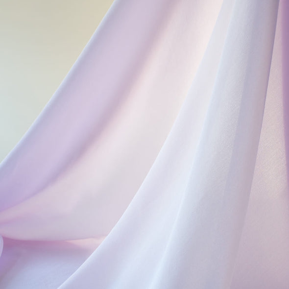 Dreamy Wisteria Purple 100% Silk Crepe de Chine ...brings to mind the first spring blooms. Create a lovely top or dress in this soft color that is versatile and flattering. Photo demonstrating fabric drape and translucence.