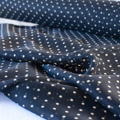 Add elegance to your project with this lovely black and Vanilla Creme 100% Silk Polka Dot Chiffon. Chiffon is sheer, has a beautiful drape and is popular in blouses, gowns, lingerie, flowy overlays, scarves, even trim. Perhaps you have seen it used as trim in those fabulous French Jackets! A technique we can't wait to try. Close up photo .