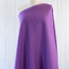 Perk up your summer wardrobe with some color!  This soft English Violet shirt-weight linen would make a perfect layering piece.  Nothing says summer style more than an open shirtdress over a column of white basics. So chic!  This is also perfect for summer dresses and tops!  Image of fabric draped on dressform.