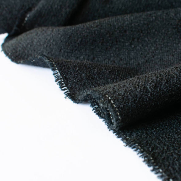 Couture Designer Flat Boucle Wool Blend fabric in black. Perfect for a French Jacket! - close up of selvedge edge